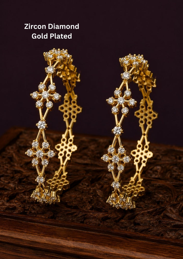 Premium floral gold plated bangles showcasing brilliant zircon detailing and an elegant handcrafted finish.
Lightweight, comfortable, and designed for all-day wear with traditional and modern outfits.
An ideal choice for weddings, festivals, gifting, and special occasions.