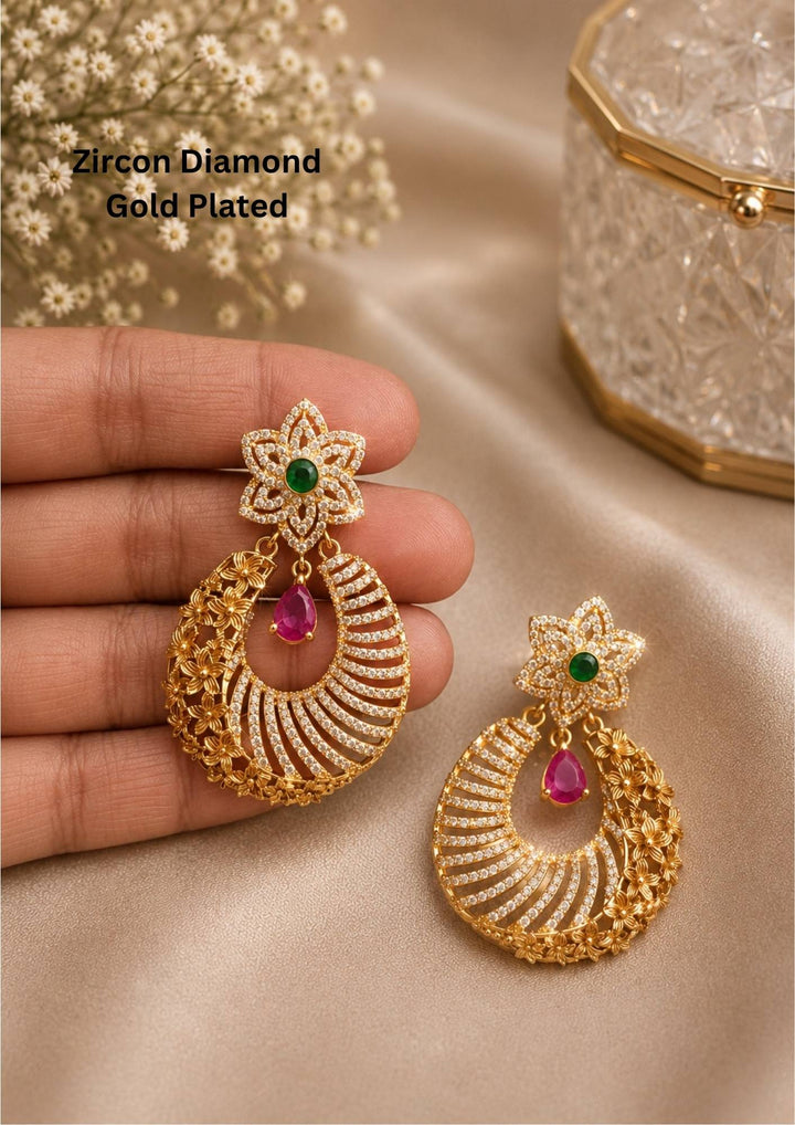 Pure Zirconian Diamond Gold Plated Floral Earrings design with emerald and pink ruby stones the pattern on the left side of the earring is in flower shape and its perfect for weddings, office and its anti fade color