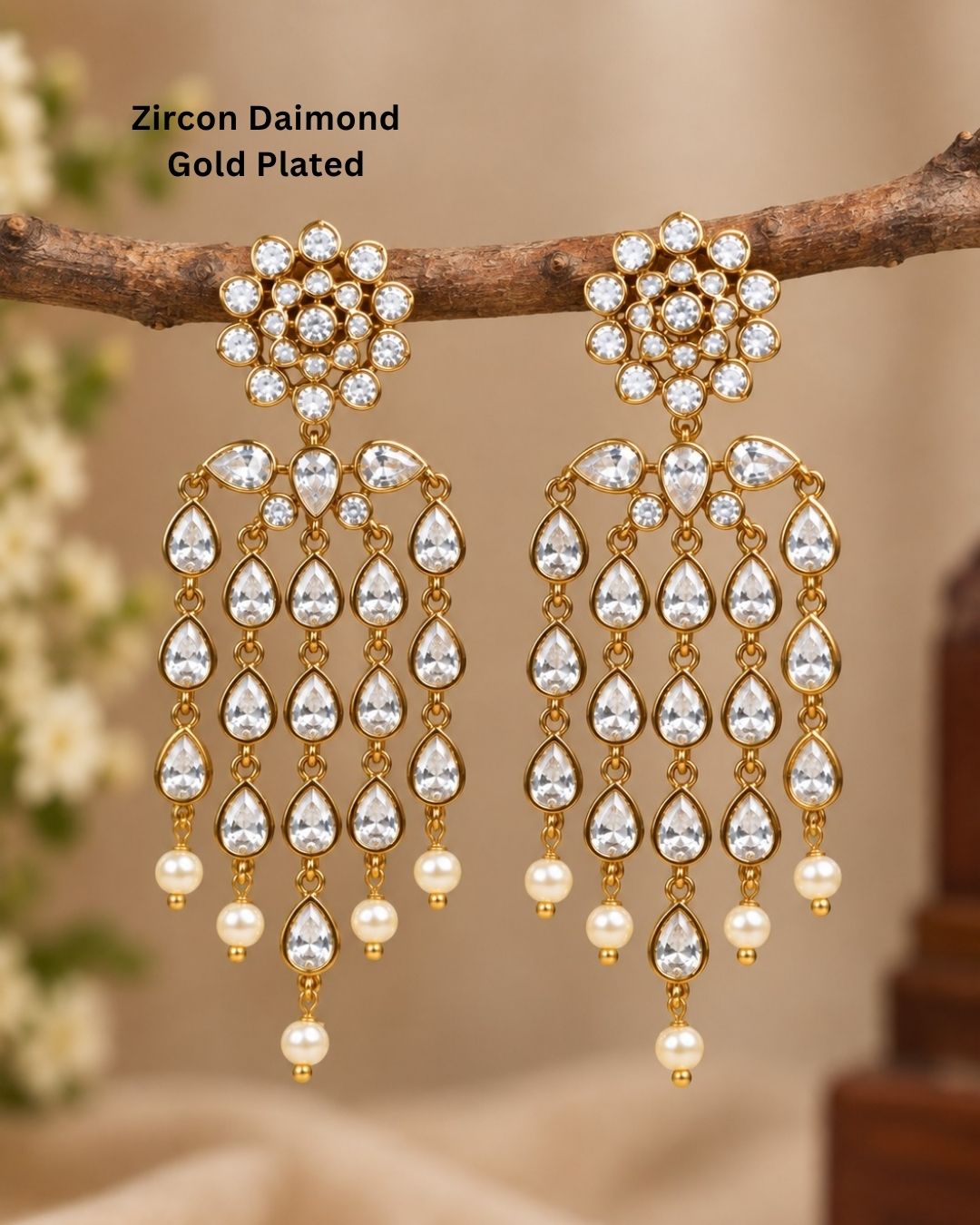  Close up offer south indian women wearing Beautiful zircon diamond gold plated chandelier earrings featuring dazzling pear-shaped zircon stones with graceful pearl drops. Perfect for weddings, receptions, parties, festive occasions, and premium gifting.