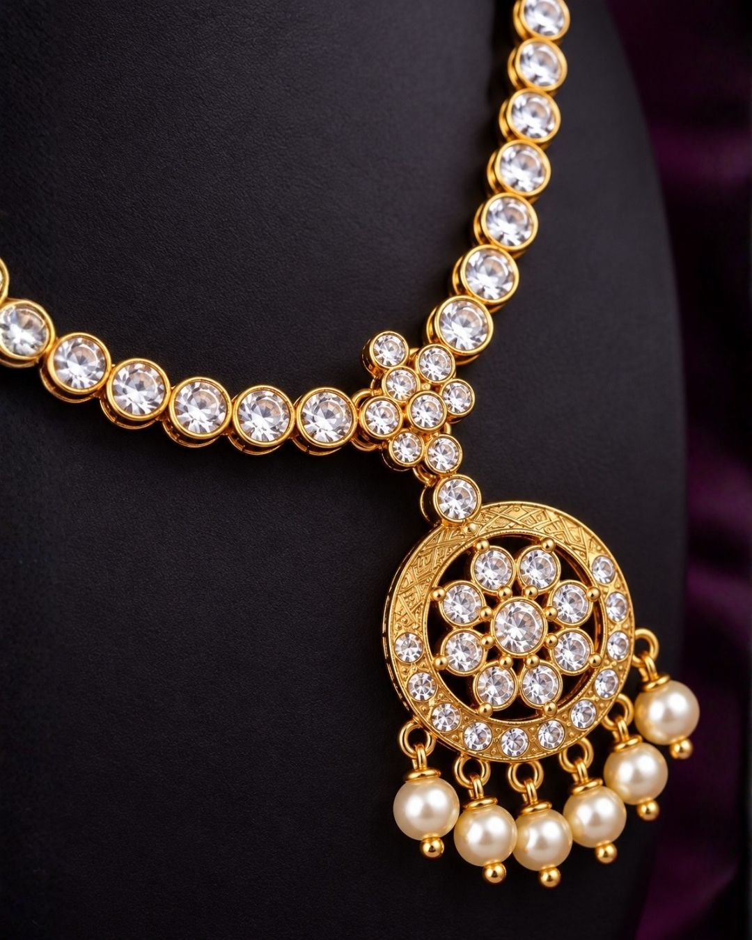 South indian Woman wearing a Gold plated zircon diamond necklace set featuring a sparkling floral pendant with pearl drops and matching earrings. Beautifully crafted with premium zircon stones, making it ideal for weddings, festive celebrations, receptions, and traditional occasions.