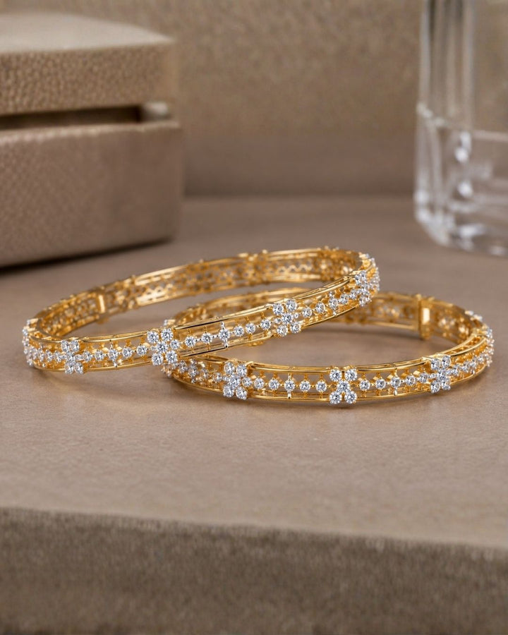 Elegant 18K gold plated zircon diamond bangles crafted with brilliant floral crystal detailing for festive and party wear.