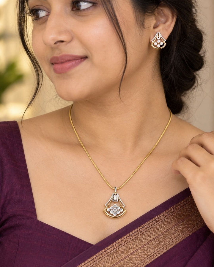 Elegant gold plated zircon diamond pendant set with sparkling crystal detailing and matching stud earrings. Perfect for daily wear, parties and gifting.