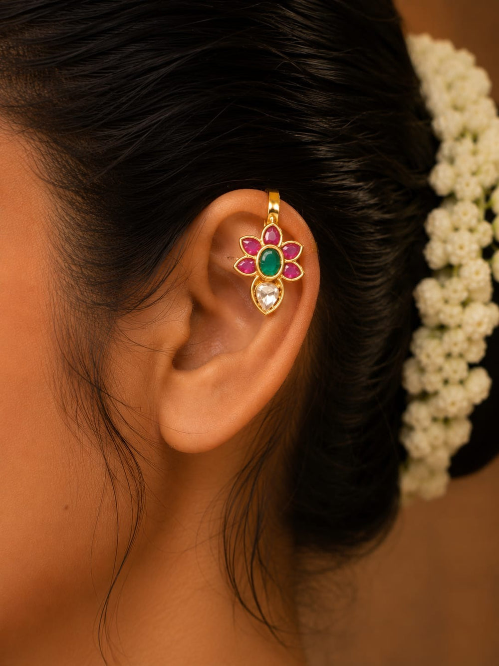 Close up offer south indiam women wearing Beautiful floral earrings designed with ruby, emerald, and sparkling kundan stones in a premium gold plated finish.
Lightweight and comfortable for festive celebrations, weddings, and traditional occasions.
A perfect accessory to complement sarees, lehengas, and ethnic outfits.