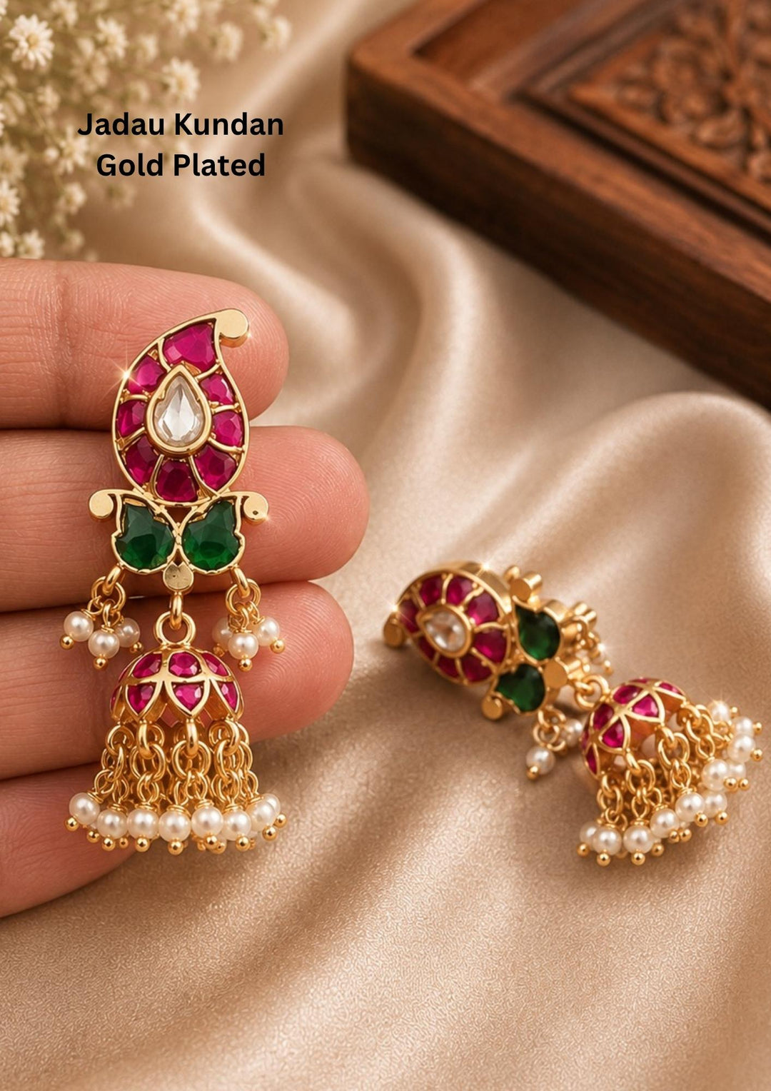 Gold plated jadau kundan earrings with white pearl hangings bottom an its perfect for festivals, functions, parties and it is anti fade color
