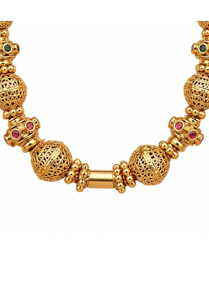 close up of Gold plated long chain haraam necklace featuring elegant textured golden spheres alternating with small spacer rings inset with red ruby and green emerald stone accents. This lightweight chain is crafted with a detailed twisted rope style chain extension held in hand to provide a classy and premium appearance suitable for daily wear, office wear, casual outings, family gatherings, festivals, parties and traditional occasions with skin friendly quality, anti fade polish, comfortable fitting