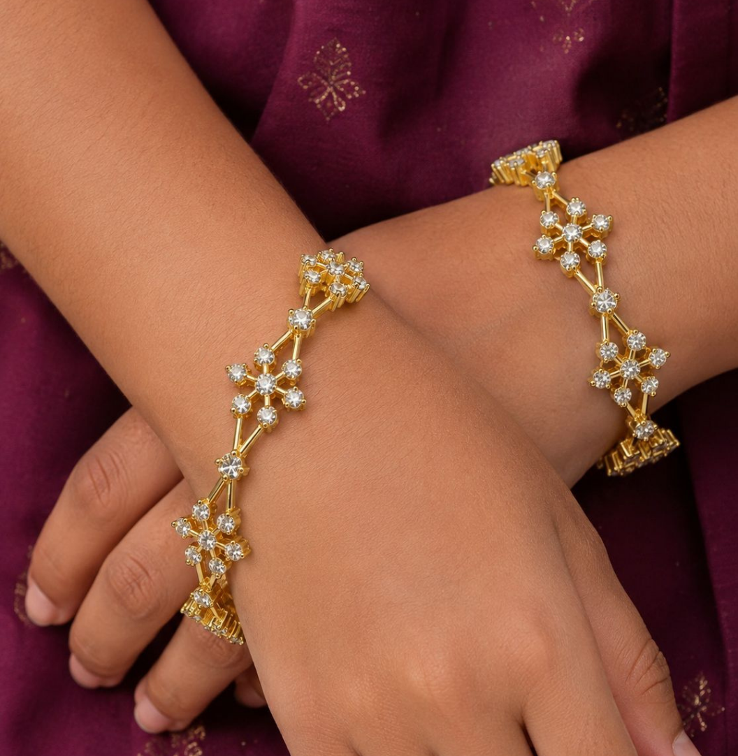 Premium floral gold plated bangles showcasing brilliant zircon detailing and an elegant handcrafted finish.
Lightweight, comfortable, and designed for all-day wear with traditional and modern outfits.
An ideal choice for weddings, festivals, gifting, and special occasions.