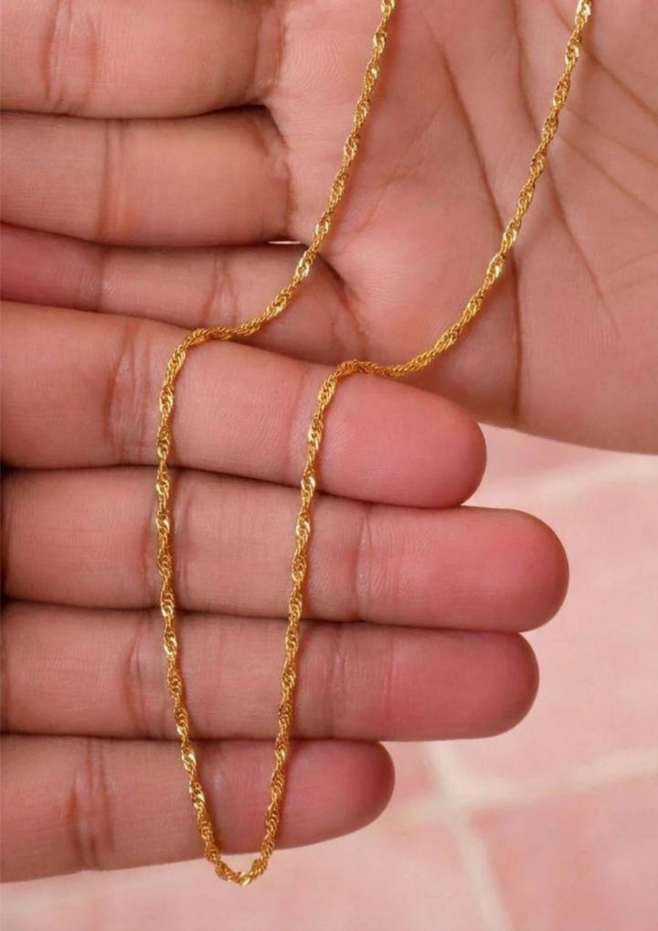 A close-up of a gold-colored twisted rope chain necklace perfect for dailywear
