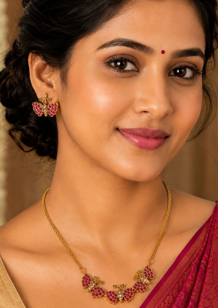 South Indian Woman wearing a gold plated butterfly model real kemp necklace set and in image clearly shown how it looks and can be use for kitty part&