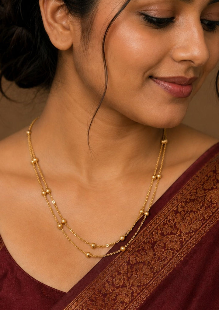 South Indian Woman wearing a Gold-plated mop chain with  Double Layer Chain and can be use for dailyware and office ware and can gift
