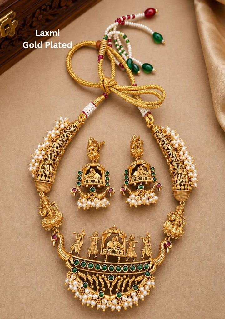 gold plated kalyanam antique Temple jewelry designed with emerald gold here it is shown that a pallaki is carriying with women and two sides there are guttapusalu perfect for birdal waer