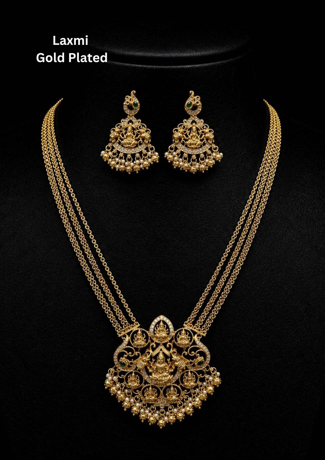 Gold-plated Lakshmi Devi necklace designed with elegant gold beads at the bottom of the locket. The locket features Ashta Lakshmis surrounding a central Lakshmi Devi seated gracefully on a lotus flower. The long haram is crafted in a stylish chain-link pattern that perfectly matches the earrings. The earrings are beautifully designed to complement the necklace, creating a traditional and elegant look. Perfect for weddingwear, poojas, festivals, functions and its anti-fade color