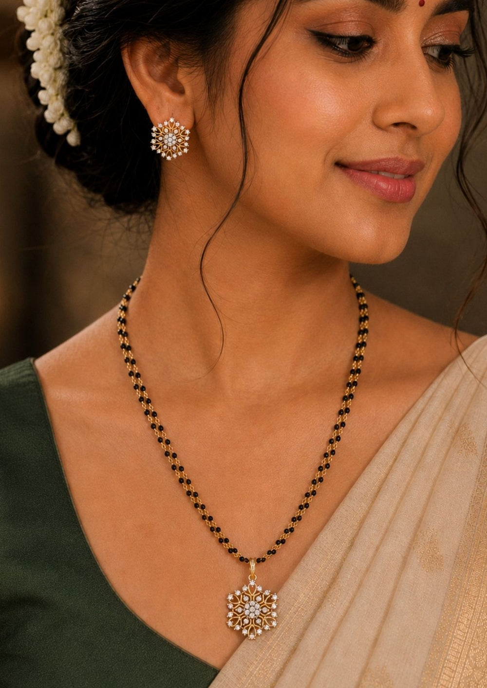 A close-up of a south indian woman wearing a Elegant gold plated mangalsutra set featuring a floral zircon pendant with matching stud earrings. Crafted with a traditional black beaded chain and sparkling crystal stones for everyday elegance and festive wear. Perfect for daily wear, festive occasions and office wear.earrings.