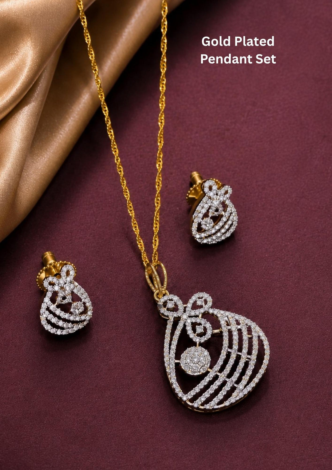Zircon diamond gold plated pendant with matching earrings featuring a sparkling floral bow-inspired design. with brilliant crystal detailing and matching stud earrings.Perfect for daily wear, gifting and special occasions.