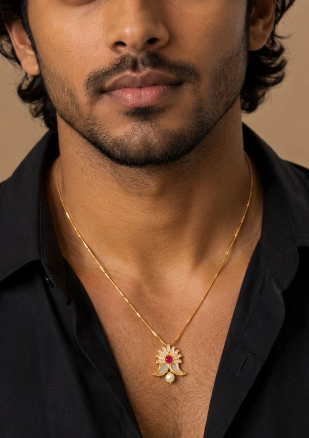 A South Indian Men wearing a gold plated puligoru chain comes with pearl drop and rudy stone in pendent and show picture clearly how it looks and anti faded and skin safe and can be used for weeding&