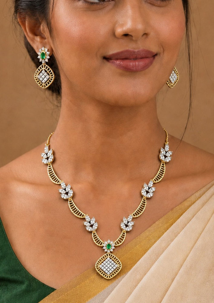 Woman wearing a Gold Plated zircon Diamond green  Emerald Leaf Pattern necklace set suits for both traditional and modern perfect for weddings, receptions, office wear, function and comes with anti tarnish color and skin friendly.