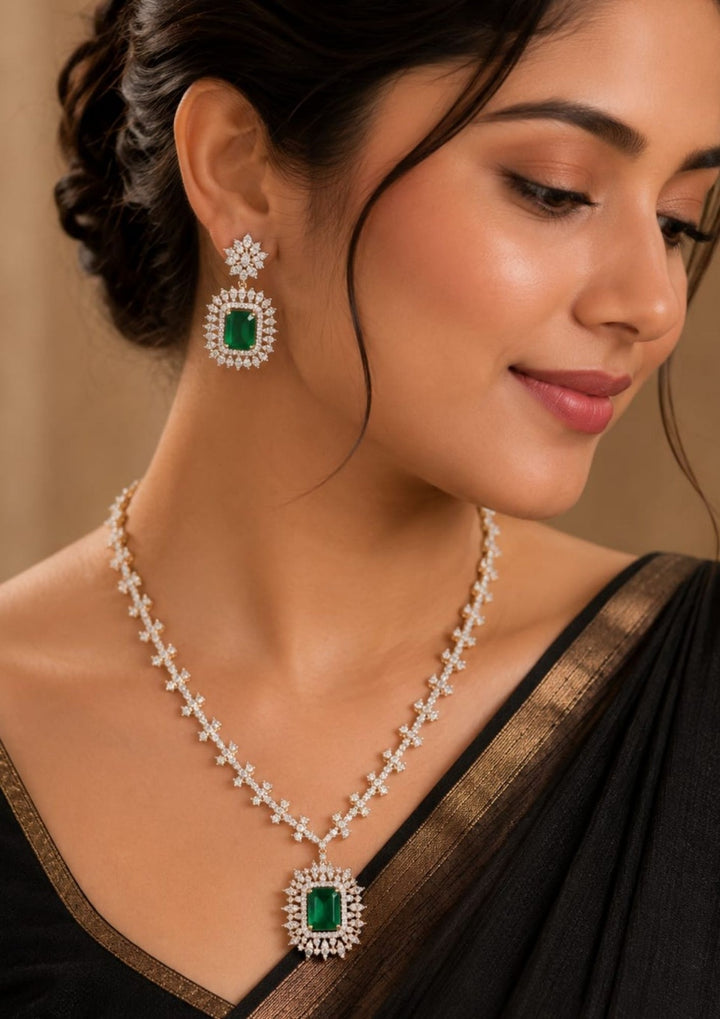 Gold-plated zircon diamond jewelry set featuring a necklace and matching drop earrings displayed. The set features rectangular green emerald-cut stones surrounded by sparkling clear stones in silver-toned settings. Lightweight and perfect for weddings, parties, festive occasions, and special celebrations.