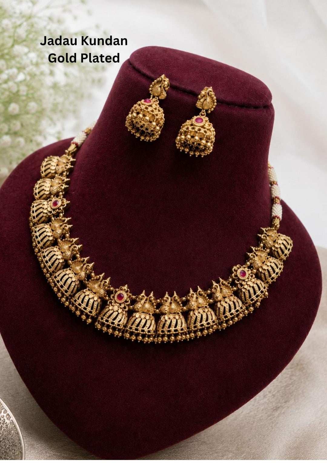 Jadau Kundan Gold Plated Ruby Half Jhumka Peacock Necklace with Earrings at Zevana. Lightweight, Anti-Tarnish, Perfect for dailywear, weddings & festivals. Pan-India delivery available.