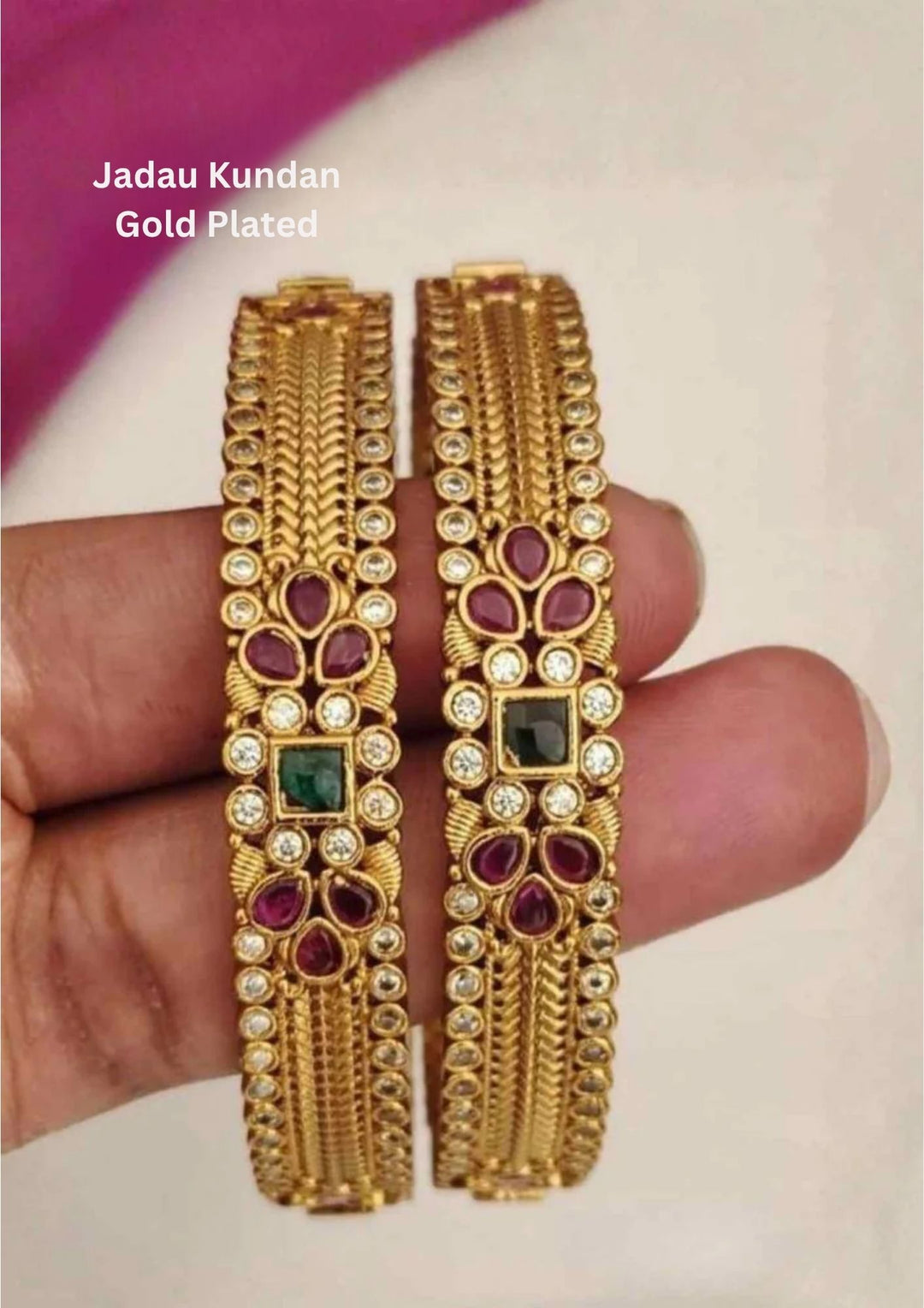 jadau kundan gold-plated bangles design with ruby and emerald and red kempu stones, sparkling white pearls. Perfect for weddings, and functions. The bangles are lightweight, comfortable, skin-safe, and give a rich bridal-style look