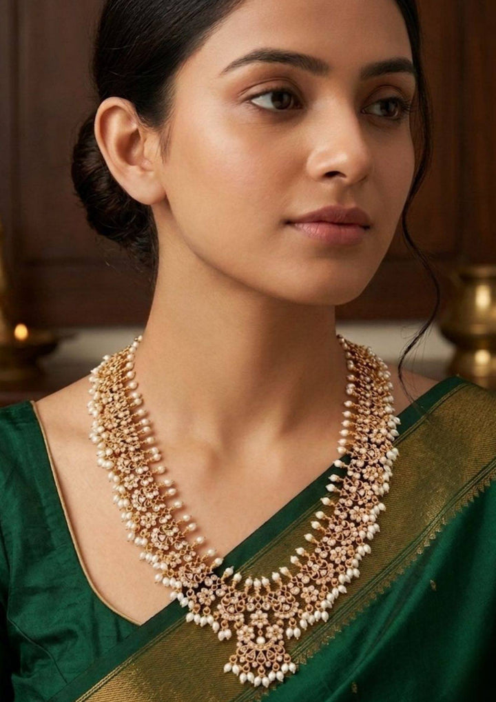 South indian woman wearing delicate gold plated rice beads with gutapusallu , traditional look for pooja and weeding's in pattu saree