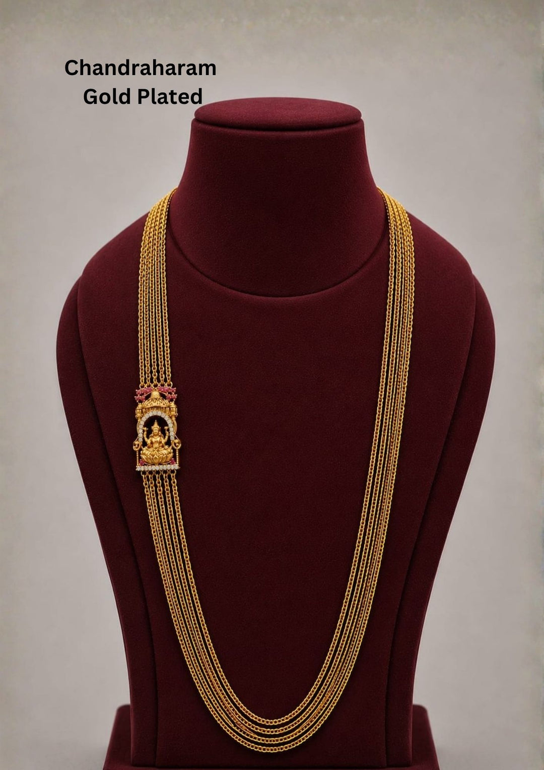 Elegant gold plated Chandraharam featuring multiple layered chains with a beautifully crafted Lakshmi temple motif centerpiece. Inspired by traditional South Indian temple jewellery, this long haram is perfect for weddings, festive celebrations, and bridal occasions.