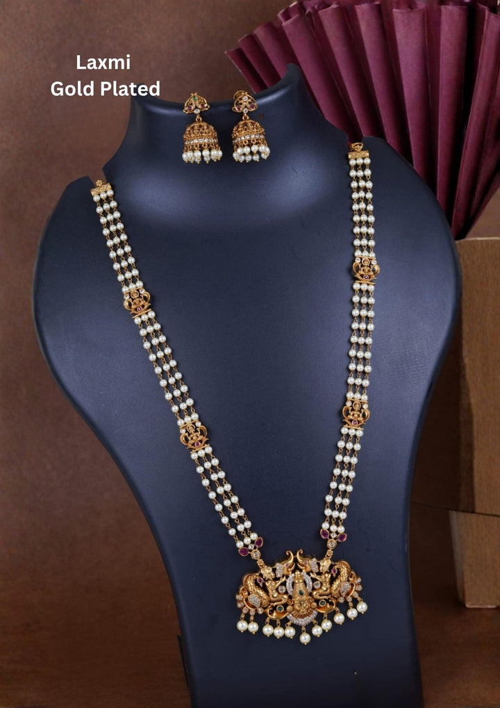 Jadau Kundan Gold Plated Temple Lakshmi Devi Beaded Necklace with Earrings design with pearl drop hangings with three row chain with whitw pearl drops . perfect for weddings