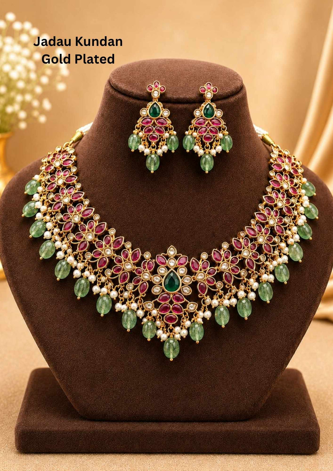 Traditional style 18K gold plated Jadau choker necklace set designed with a pink stone border band, sparkling kundan outlines, a central crescent pendant, and rows of hanging white pearl drops that give a graceful traditional look for festive celebrations, poojas, family functions, and bridal outfits.