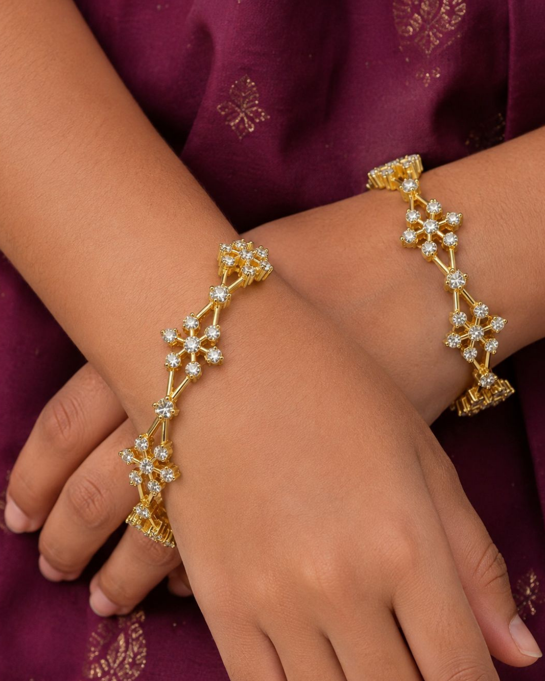 Premium floral gold plated bangles showcasing brilliant zircon detailing and an elegant handcrafted finish.
Lightweight, comfortable, and designed for all-day wear with traditional and modern outfits.
An ideal choice for weddings, festivals, gifting, and special occasions.