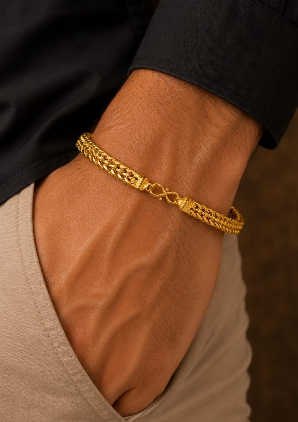 Close up offer for south indians mens wearing hand bracelet A gold-plated men's chain bracelet with a textured rope-style link design and a spring-ring clasp. Perfect for dailywear , parties , weddings and it is best for skin friendly .