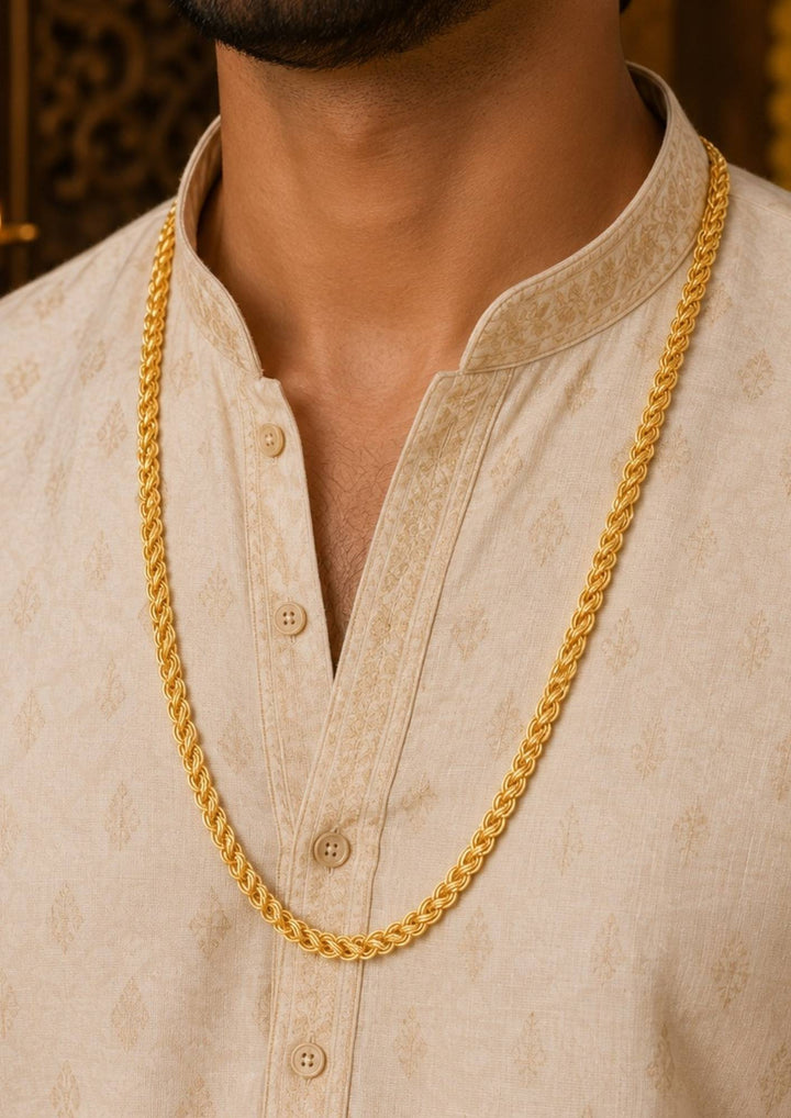 A close-up of a man wearing a thick, shiny gold rope chain necklace perfect for daily wear and come with anti tarnish color