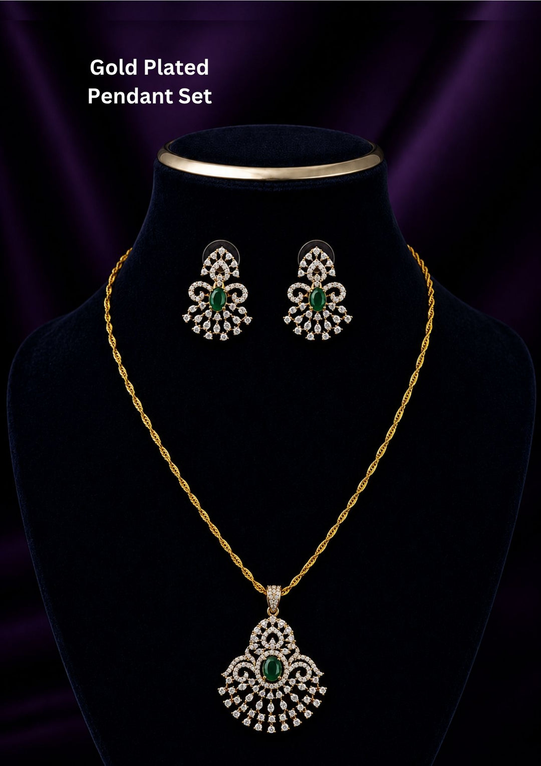 Gold-plated pendant necklace and matching earrings The pendant and matching earrings feature intricate silver-toned filigree with green stone accents in the center.