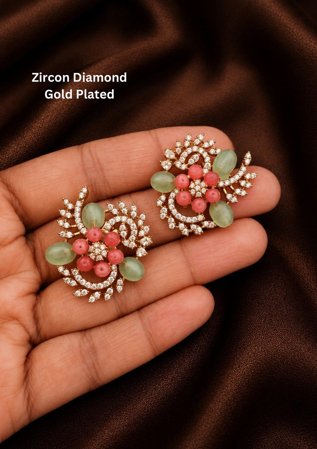 Gold-plated zircon diamond earrings with pink and green stones in curve shaped pattern best for daily wear, office wear and its antifade color